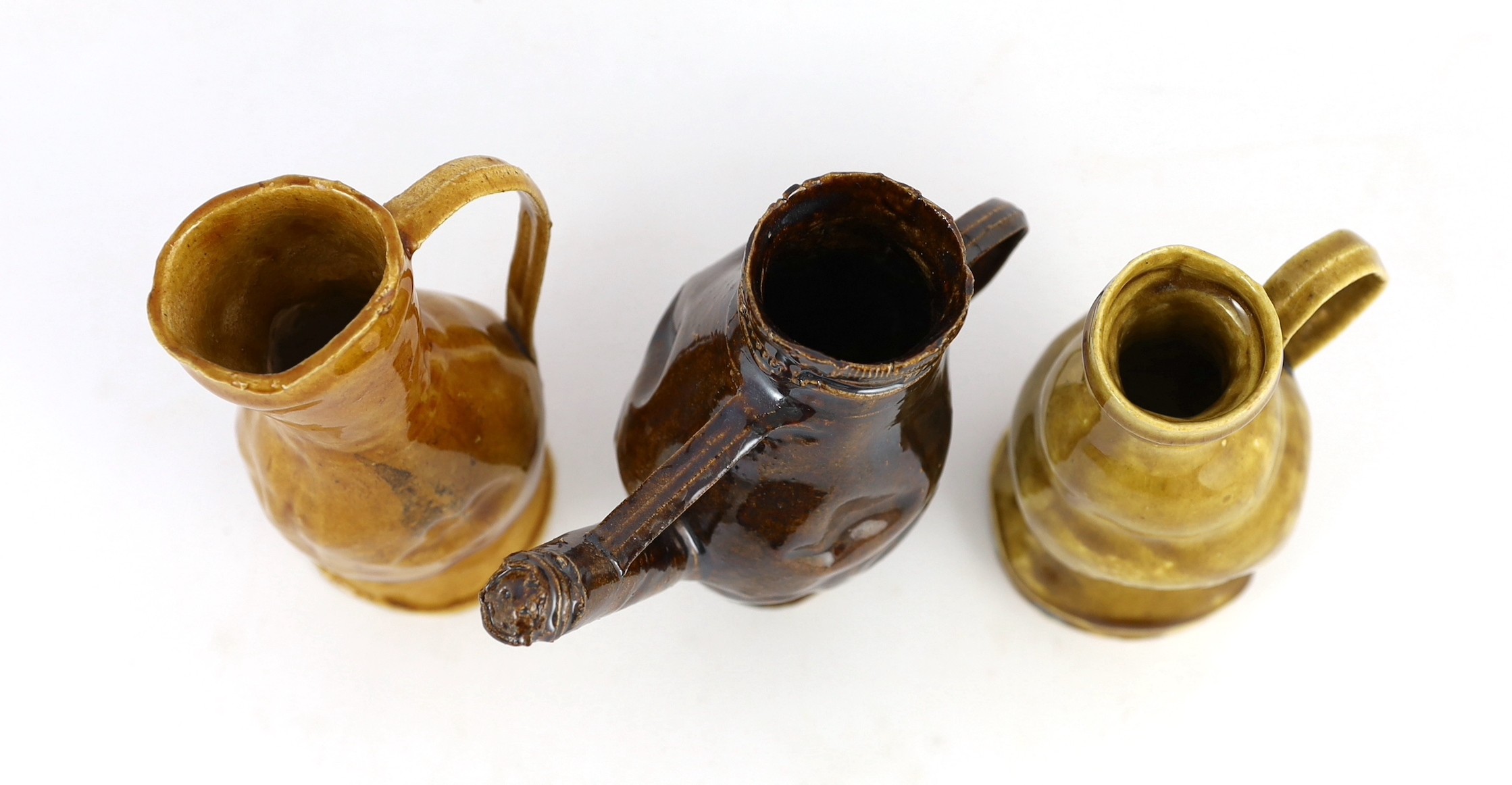 Philip Egin (b.1959), a series of three crumpled monochrome glazed pottery jugs, c.2020, 16.7cm - 17.5cm